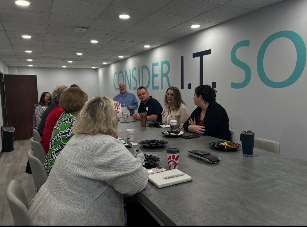 Nonprofit leaders at a Tight Technologies workshop breakfast